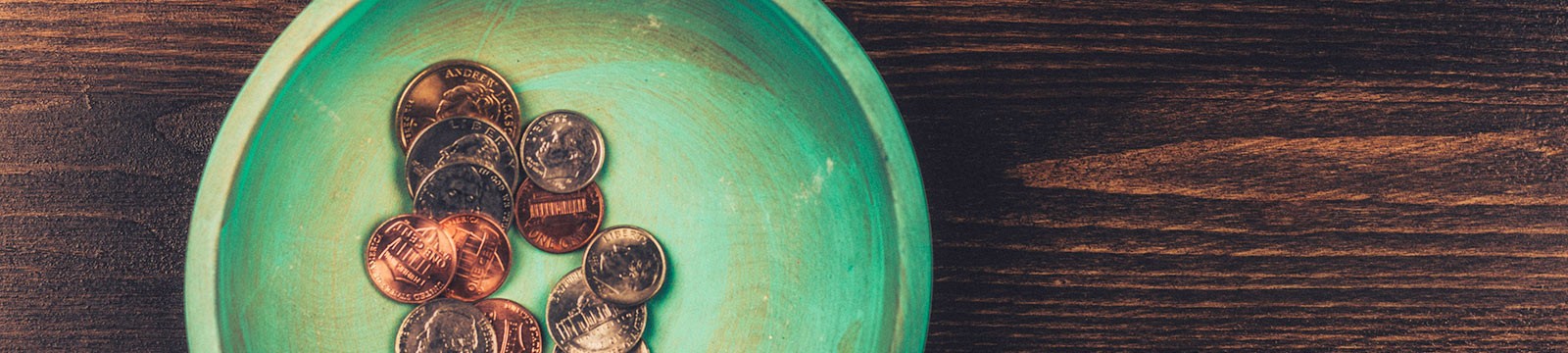 coins in a green bowl
